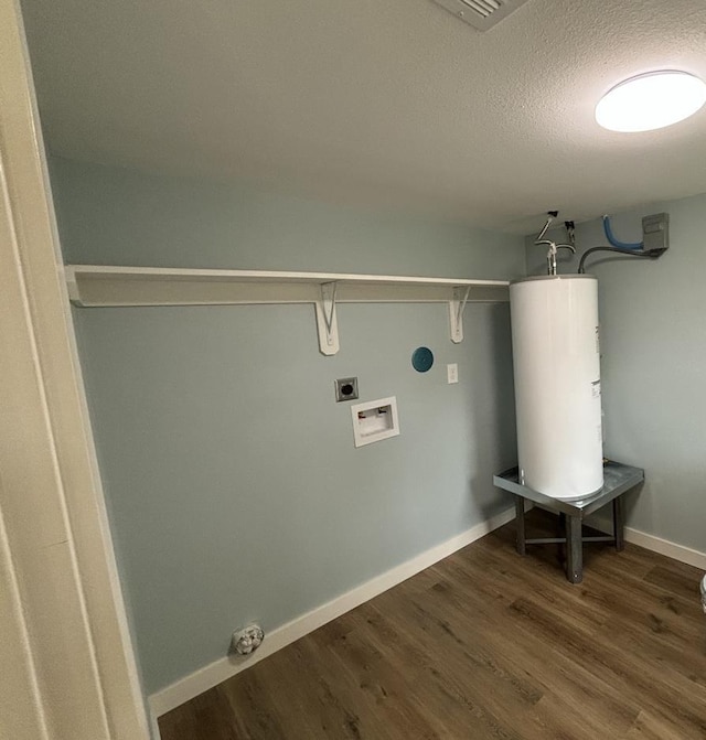 washroom featuring electric dryer hookup, hookup for a washing machine, a textured ceiling, water heater, and dark hardwood / wood-style flooring