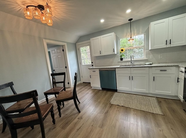 kitchen with white cabinets, pendant lighting, dishwasher, and sink