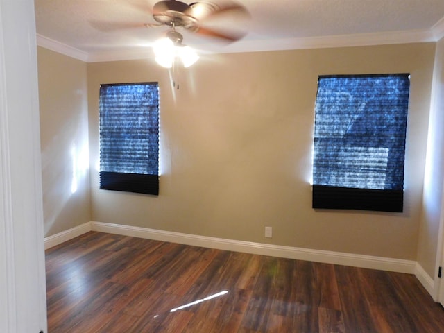 spare room featuring ornamental molding, ceiling fan, baseboards, and wood finished floors