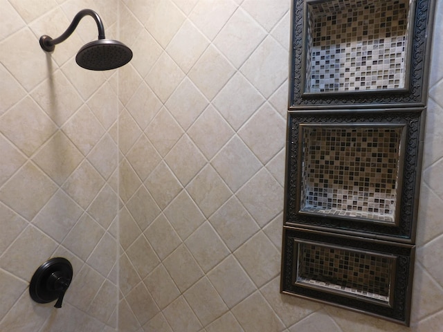 bathroom with tiled shower