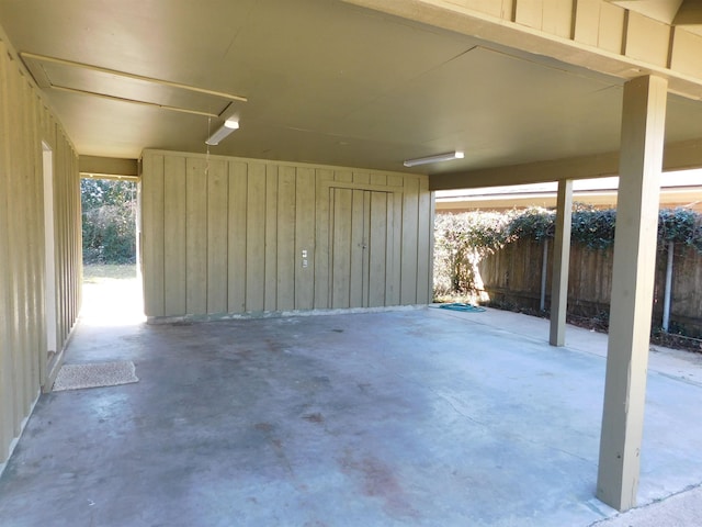 garage featuring fence