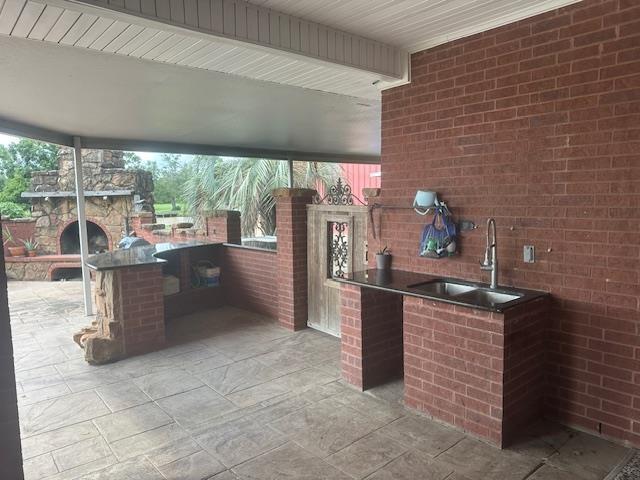 10994 Bessie Heights Rd, Orange, TX 77630 - view of patio with an outdoor kitchen