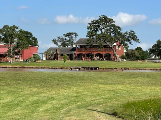 10994 Bessie Heights Rd, Orange, TX 77630 - view of community with a water view and a yard