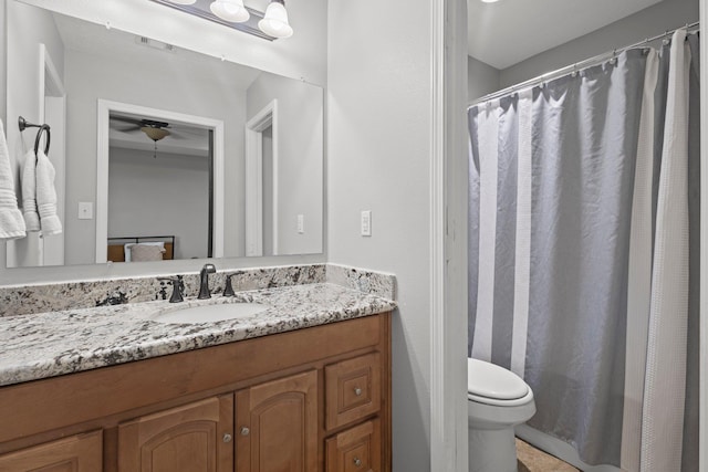 6605 Palace Dr, Lumberton, TX 77657 - bathroom featuring vanity, toilet, a ceiling fan, and a shower with shower curtain