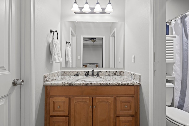 6605 Palace Dr, Lumberton, TX 77657 - full bathroom featuring vanity, toilet, and a ceiling fan
