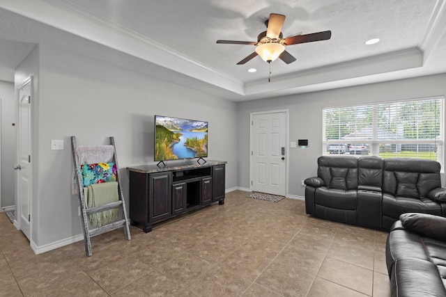 6605 Palace Dr, Lumberton, TX 77657 - living room with a tray ceiling, a ceiling fan, baseboards, ornamental molding, and light tile patterned flooring