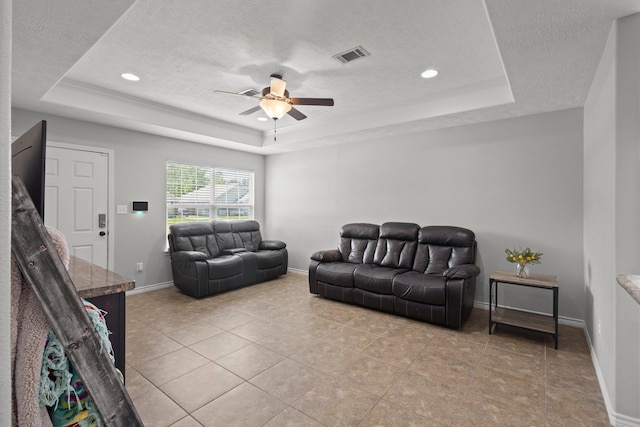 6605 Palace Dr, Lumberton, TX 77657 - living area with a raised ceiling, a textured ceiling, ceiling fan, baseboards, and recessed lighting
