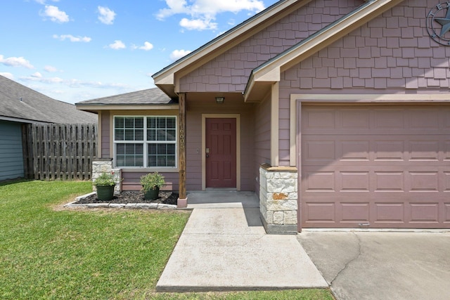 6605 Palace Dr, Lumberton, TX 77657 - view of exterior entry with an attached garage and stone siding