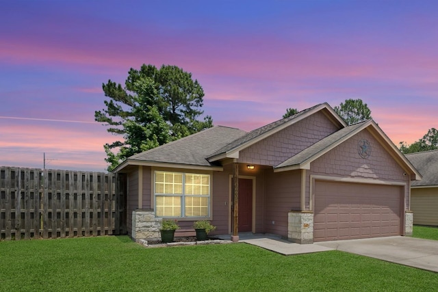 6605 Palace Dr, Lumberton, TX 77657 - view of front facade featuring an attached garage, concrete driveway, stone siding, and a shingled roof