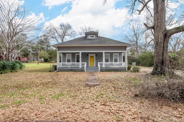 view of front of property with a front yard and covered porch