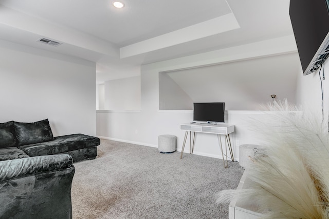 1560 Alice Dr, Beaumont, TX 77705 - carpeted living area with baseboards and a raised ceiling