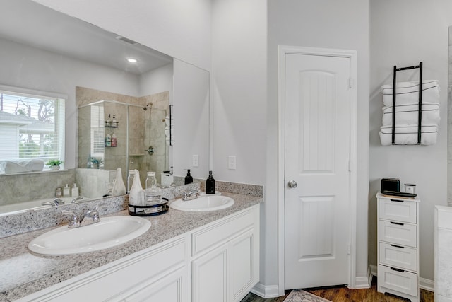 1560 Alice Dr, Beaumont, TX 77705 - full bath with a shower stall, double vanity, a bath, and wood finished floors