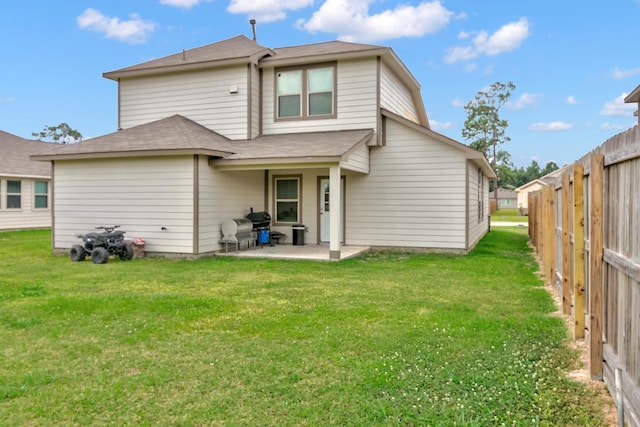 1560 Alice Dr, Beaumont, TX 77705 - rear view of house with a patio and a shingled roof