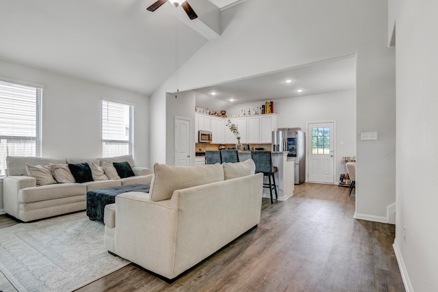 1560 Alice Dr, Beaumont, TX 77705 - living area featuring wood finished floors, a ceiling fan, recessed lighting, beamed ceiling, and baseboards