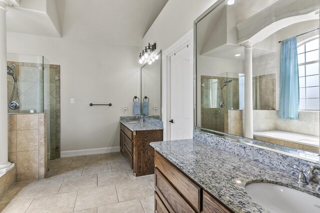 bathroom with ornate columns, vanity, independent shower and bath, and tile patterned floors