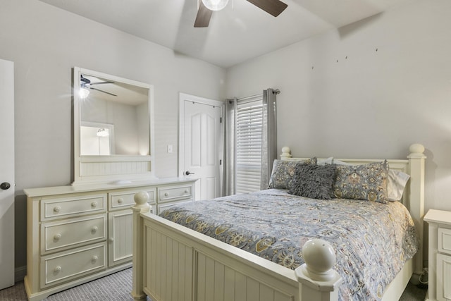 bedroom with ceiling fan and light carpet