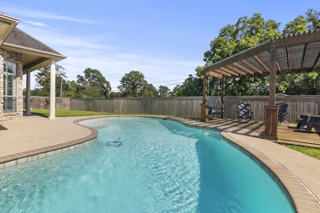 view of swimming pool with a pergola and a deck