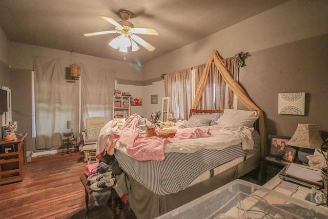 bedroom with hardwood / wood-style flooring and ceiling fan