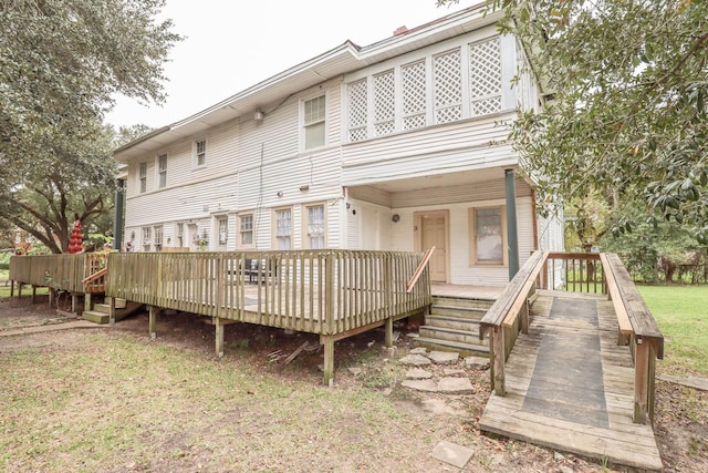 rear view of house featuring a deck