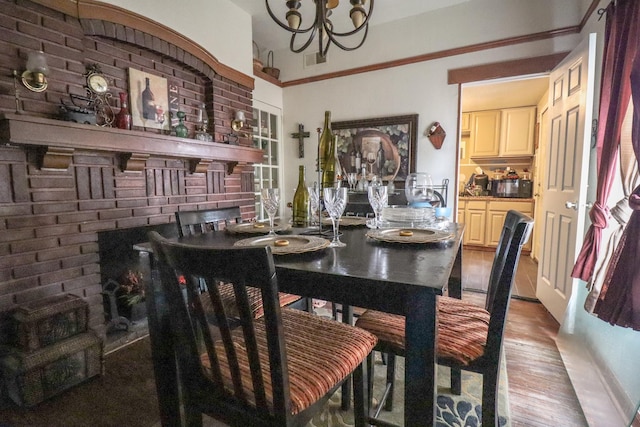 dining area featuring hardwood / wood-style floors and a chandelier