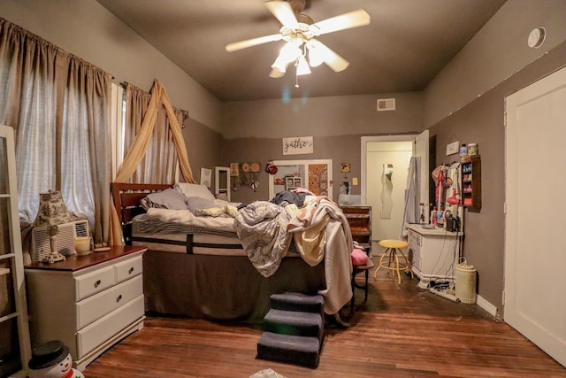 bedroom featuring ceiling fan and dark hardwood / wood-style flooring