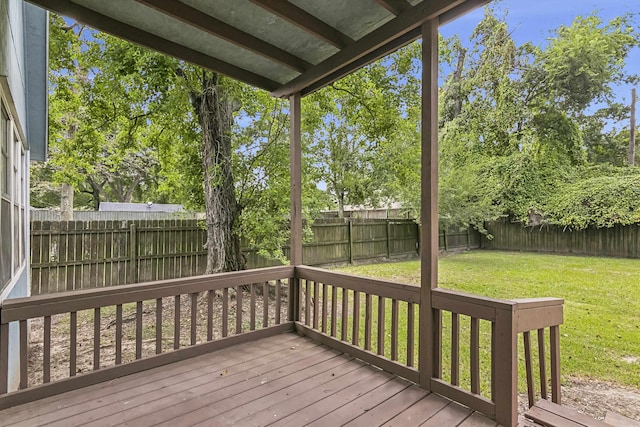 wooden terrace with a lawn