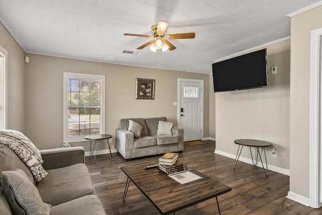 living room with dark hardwood / wood-style floors, ceiling fan, and ornamental molding