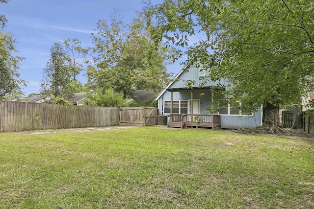 view of yard with a wooden deck