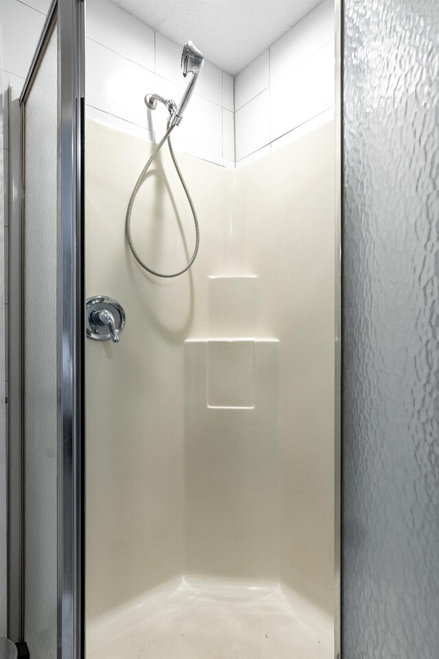 bathroom featuring an enclosed shower