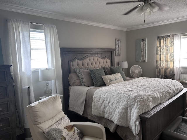 bedroom featuring a textured ceiling, multiple windows, a ceiling fan, and crown molding