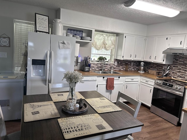 kitchen with white dishwasher, a sink, refrigerator with ice dispenser, white cabinets, and stainless steel electric stove