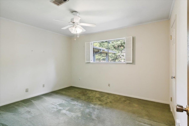 unfurnished room with carpet and crown molding