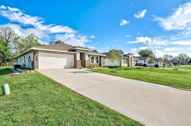 view of front of property with a front yard and a garage