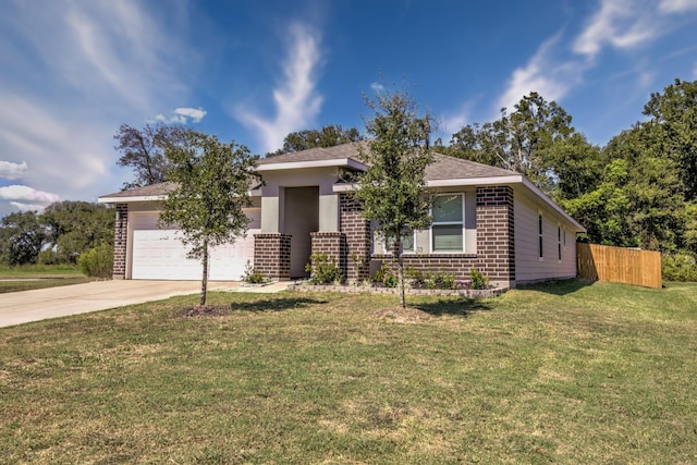 view of front facade featuring a front yard and a garage