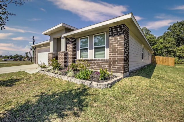 view of property exterior with a yard and a garage