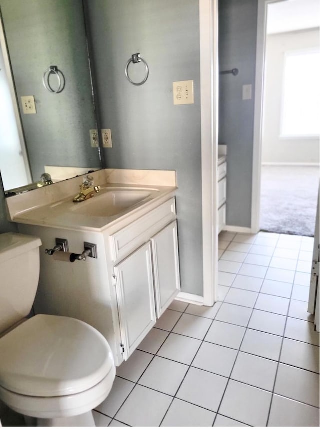 bathroom with tile patterned floors, toilet, and sink