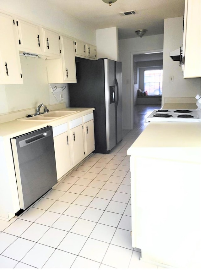 kitchen featuring ventilation hood, stainless steel appliances, light tile patterned floors, and sink