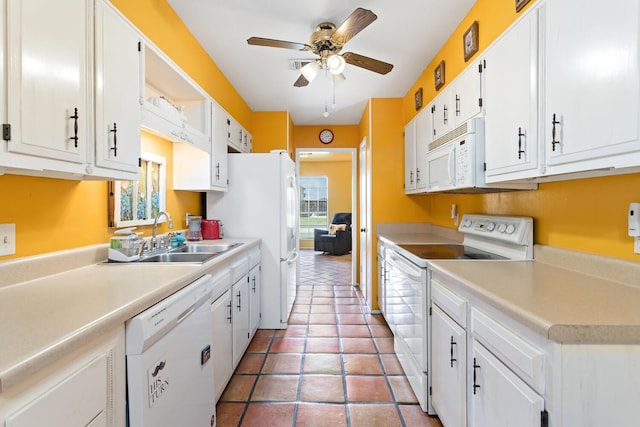 9055 Glen Mdw, Beaumont, TX 77706 - kitchen featuring white appliances, ceiling fan, white cabinetry, light countertops, and light tile patterned floors