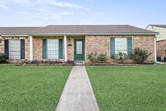 9055 Glen Mdw, Beaumont, TX 77706 - ranch-style home with brick siding, a front lawn, and a shingled roof
