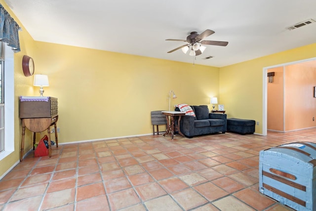 9055 Glen Mdw, Beaumont, TX 77706 - living area with a ceiling fan and light tile patterned floors
