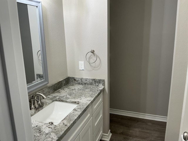 bathroom featuring vanity and hardwood / wood-style floors