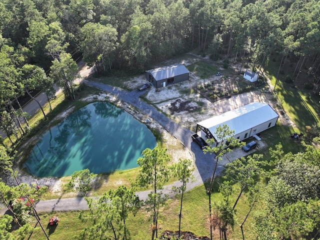 bird's eye view featuring a wooded view