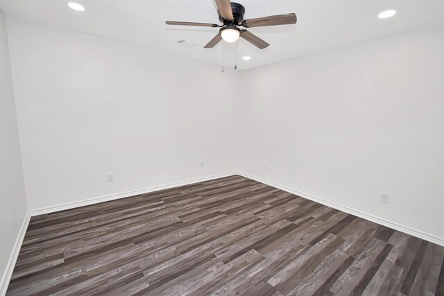 empty room featuring recessed lighting, baseboards, a ceiling fan, and dark wood-style flooring