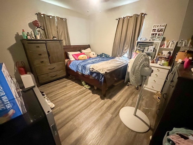 bedroom with wood-type flooring