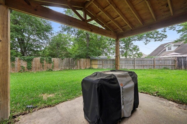 view of yard featuring a patio and a fenced backyard
