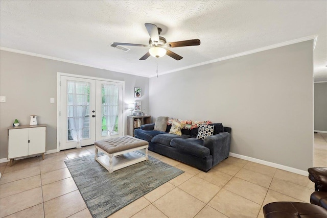living area featuring visible vents, light tile patterned floors, a ceiling fan, and french doors