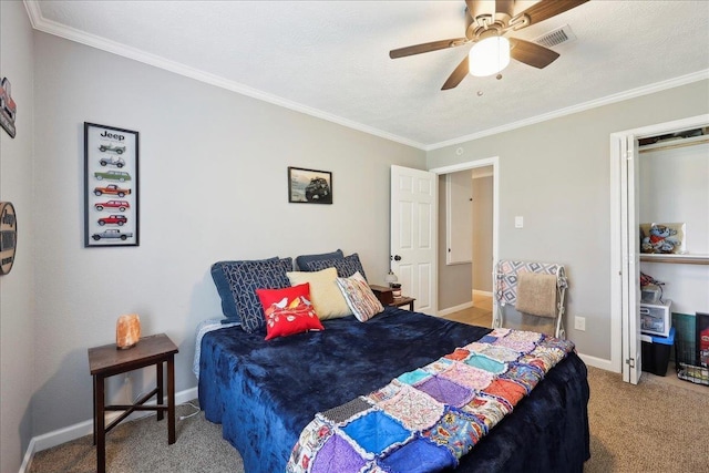 carpeted bedroom with ornamental molding, a ceiling fan, and baseboards