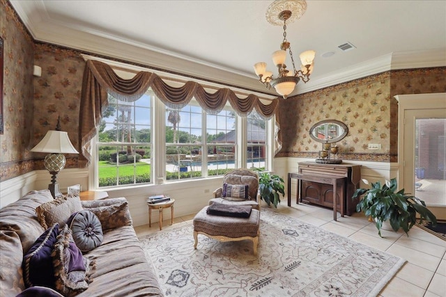 7510 Shadow Creek Dr, Beaumont, TX 77707 - living room with wallpapered walls, ornamental molding, a chandelier, wainscoting, and light tile patterned floors