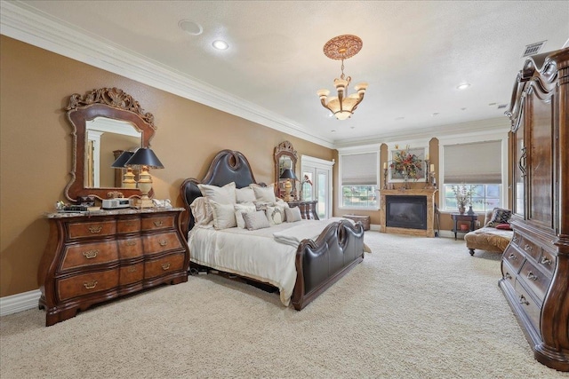 7510 Shadow Creek Dr, Beaumont, TX 77707 - bedroom featuring light colored carpet, a chandelier, ornamental molding, a glass covered fireplace, and recessed lighting