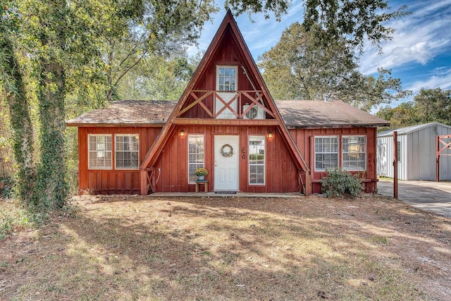 view of front of house featuring a storage shed